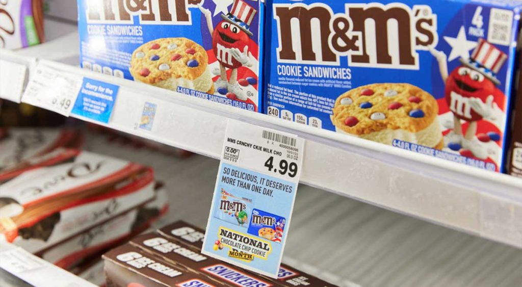 M&M's ice cream cookie sandwiches on a store shelf with a shelfAdz tag